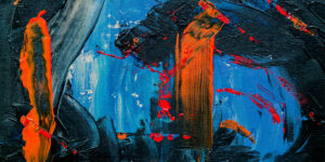 close up photo of painting with blue background, large black and orange brushstrokes with smaller red brush strokes.